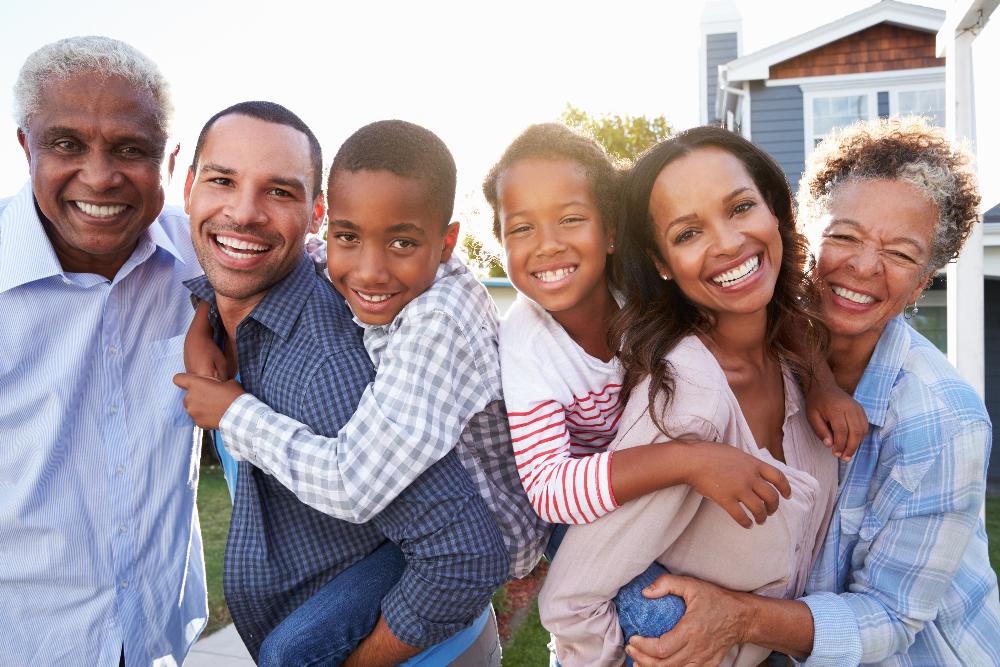 multi generaltional family hugging | family dentist white bear lake mn