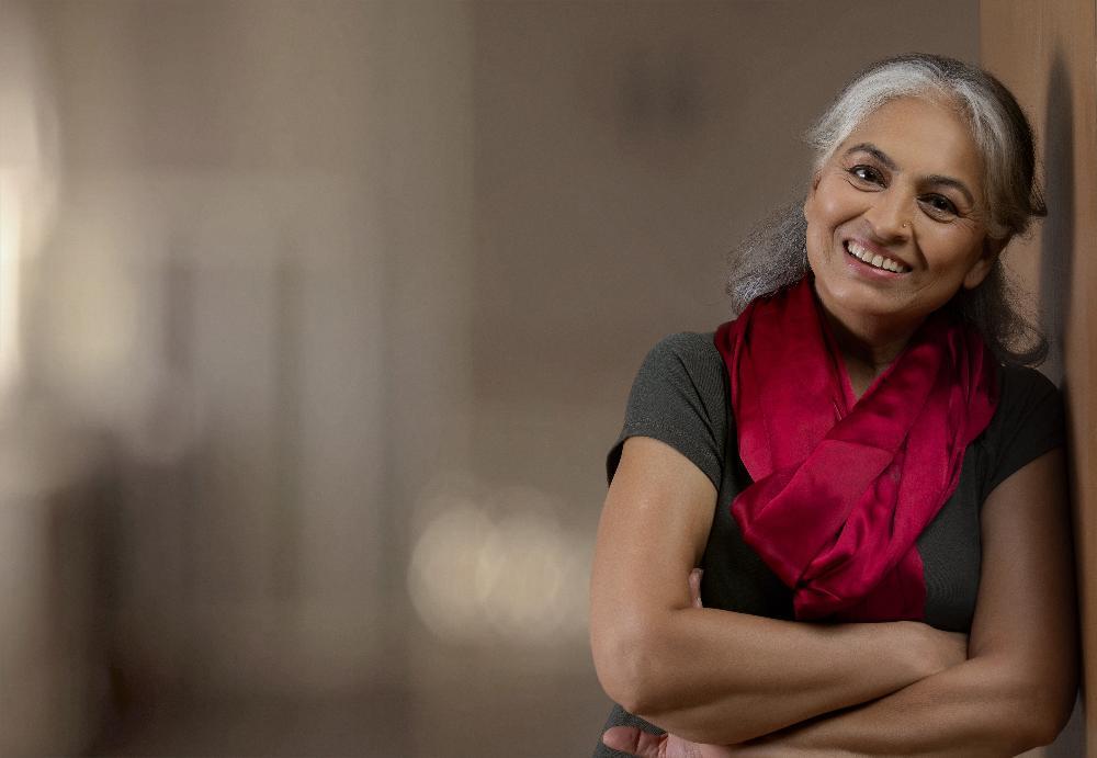 woman in red scarf smiling | tooth extraction white bear lake