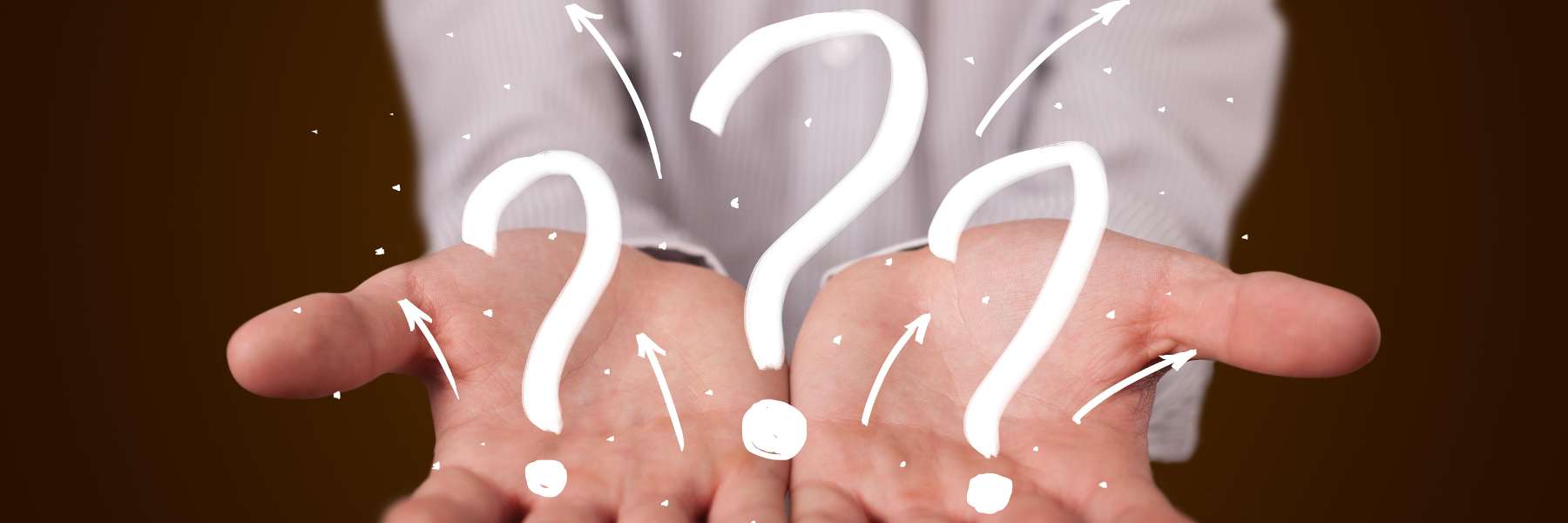 close up of hands with question marks | dentist white bear lake mn