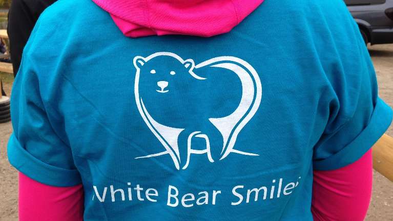 close up of white bear smiles shirt | white bear lake dentist