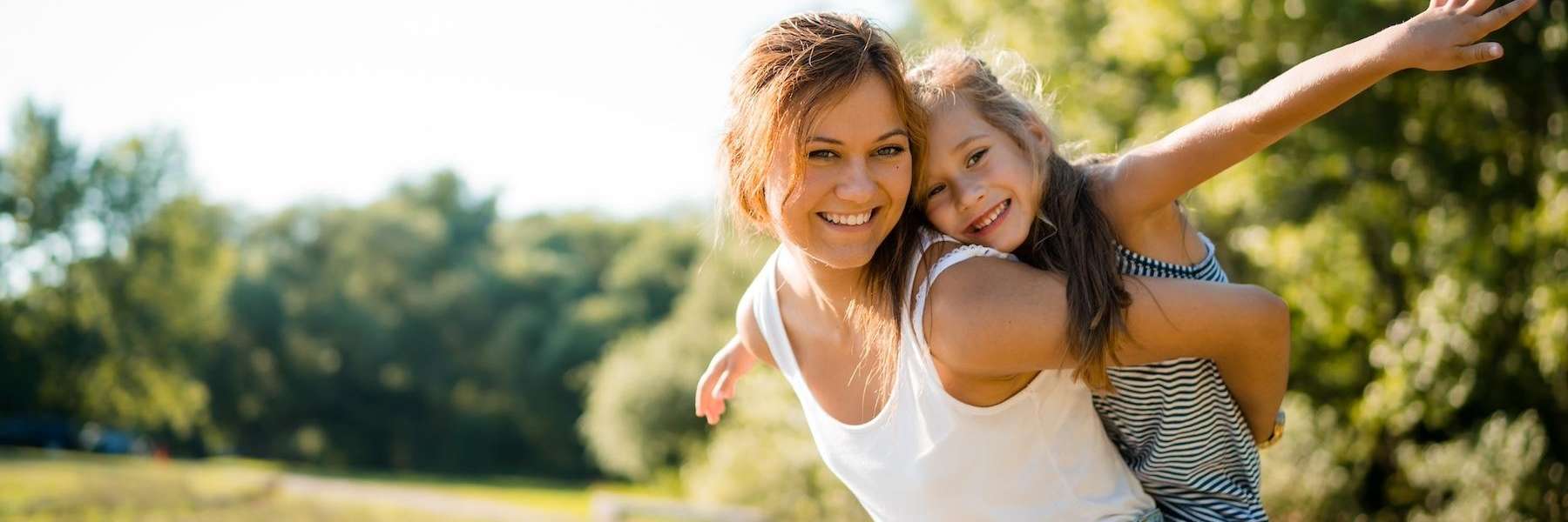mother and her daughter smiling