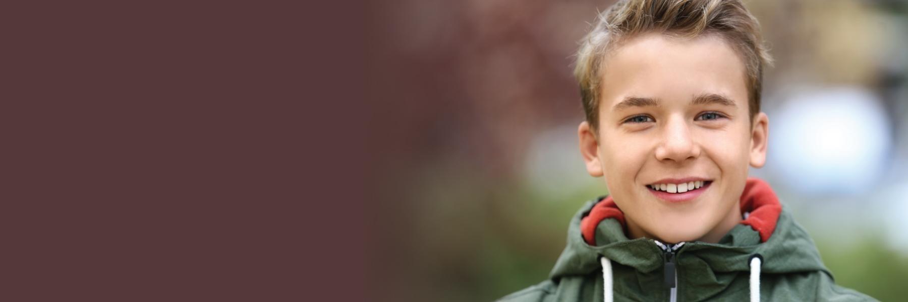 Young boy smiling outside l Children's dentistry white bear lake