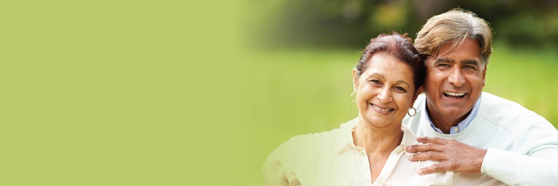 Older couple laughing & smiling outside l Dentist White Bear Lake MN