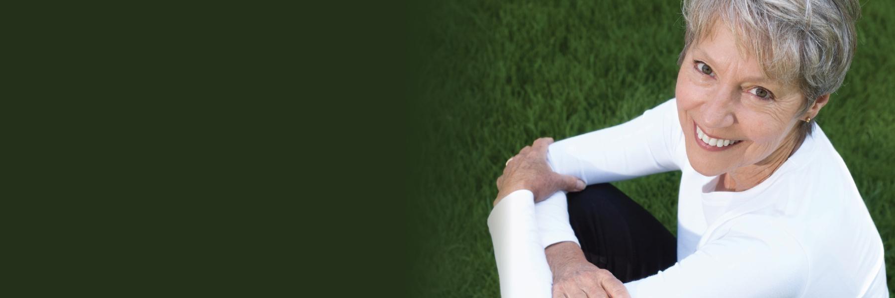 Older woman outside smiling l Periodontal treatment white bear lake