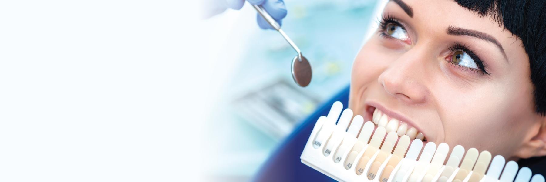 Woman picking tooth color l Teeth Whitening White Bear Lake MN