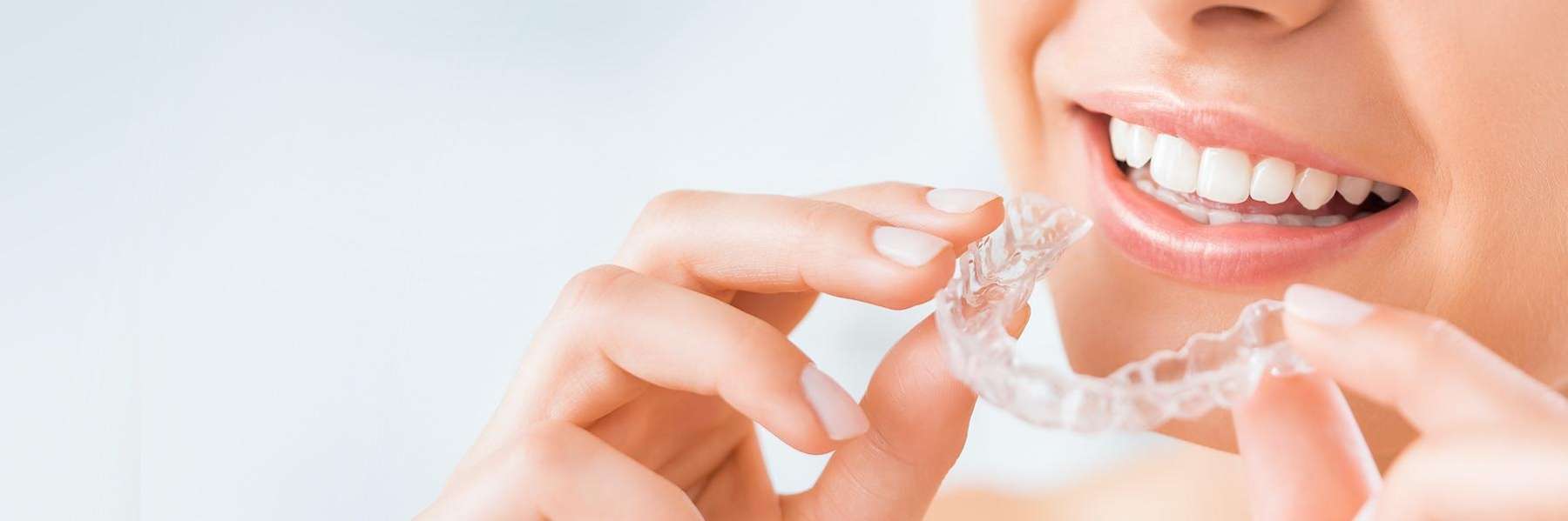 patient holding clear aligner | clear aligners in white bear lake