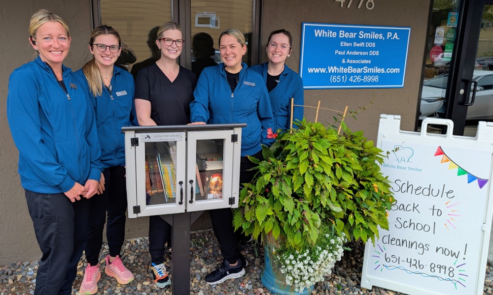 Dental team posing with our free community library